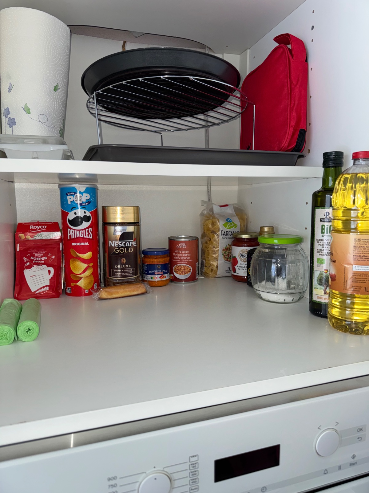 Snacks cupboard above the fridge.